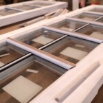 Glass panes inserted on custom wood doors.